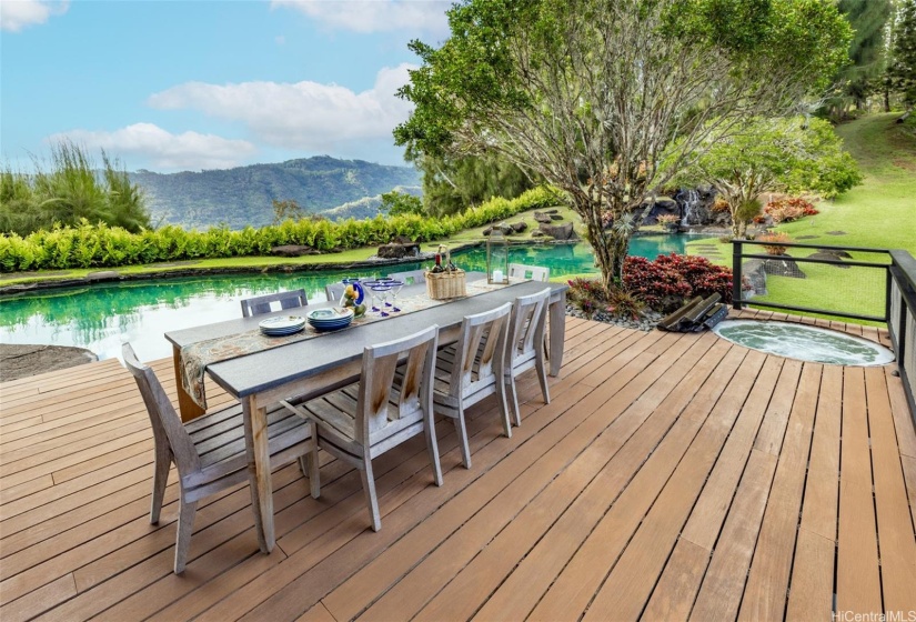 Dine on your hilltop deck by the pool and waterfall