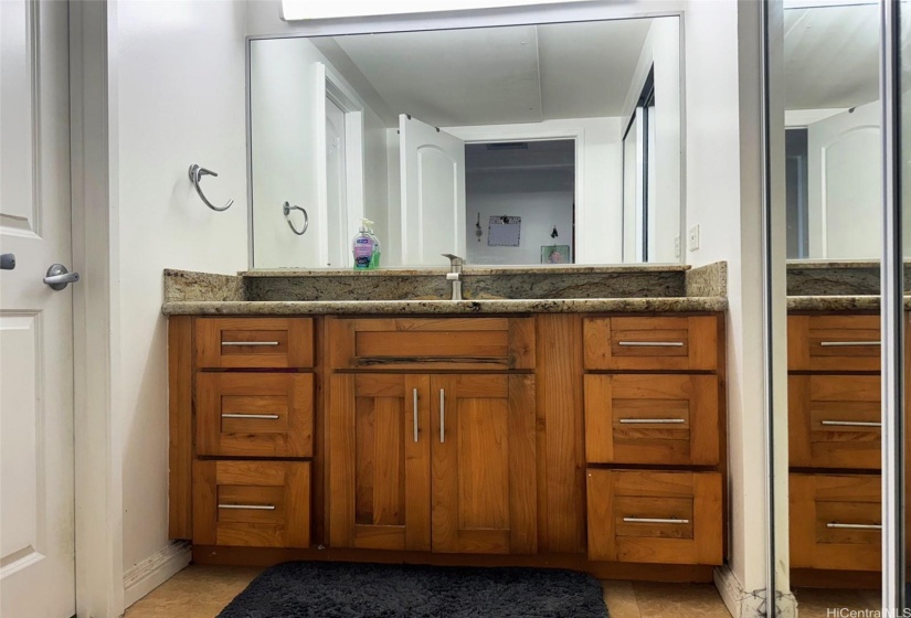 Spacious bathroom with two closets.