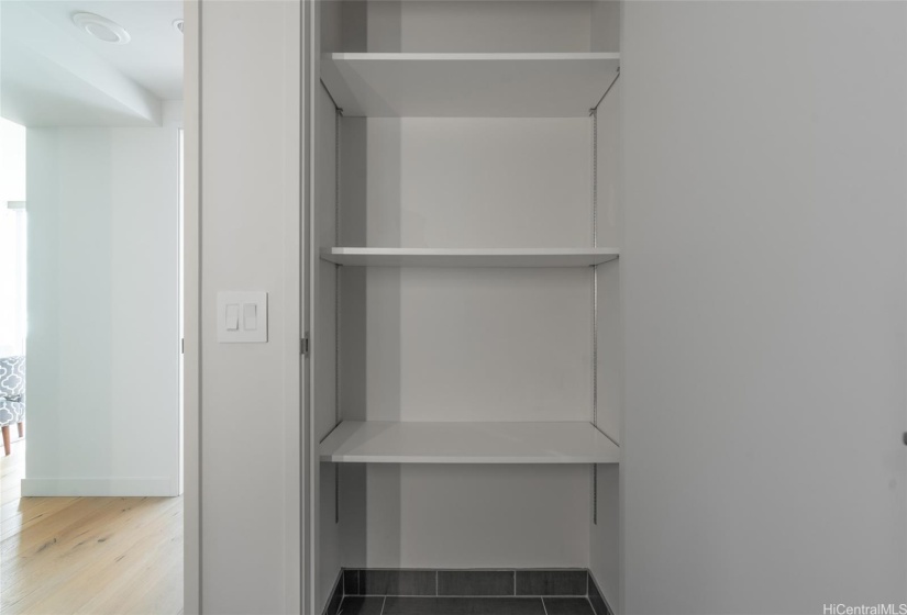 spacious linen closet in bathroom