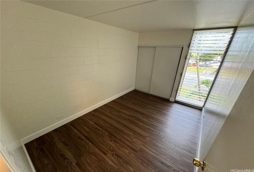 Bedroom 1 featuring mirrored closet doors