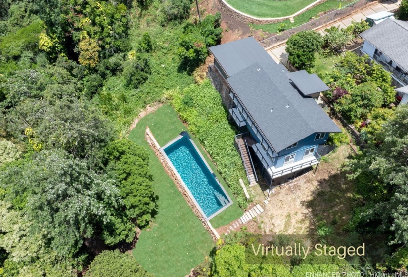 Enhanced: Virtual Pool. There is no pool on property. This is a virtual photo of a pool. New leveled backyard worth $90,000.