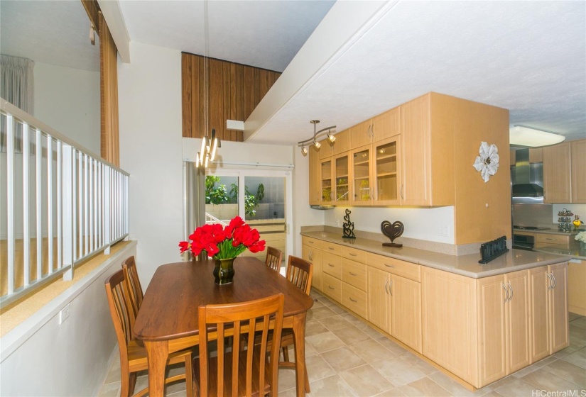 Beautiful cabinetry and counter space for extra storage, to add to the convenience of the formal dining space. Additional entry, and breeze from the sliding glass doors off to the side of the home.