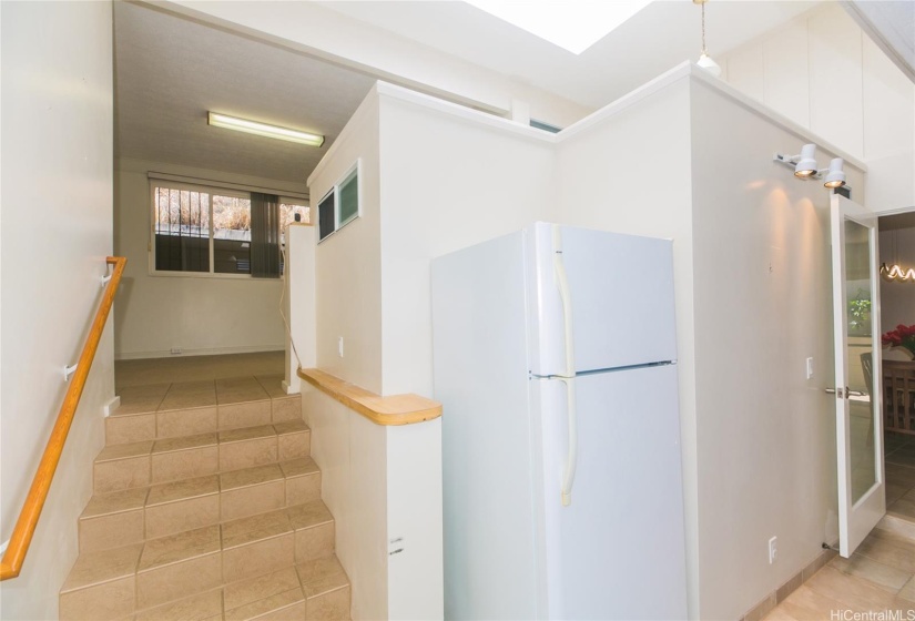 Bright with indoor skylight, laundry space with extra refrigerator (off of the dining room/kitchen area).