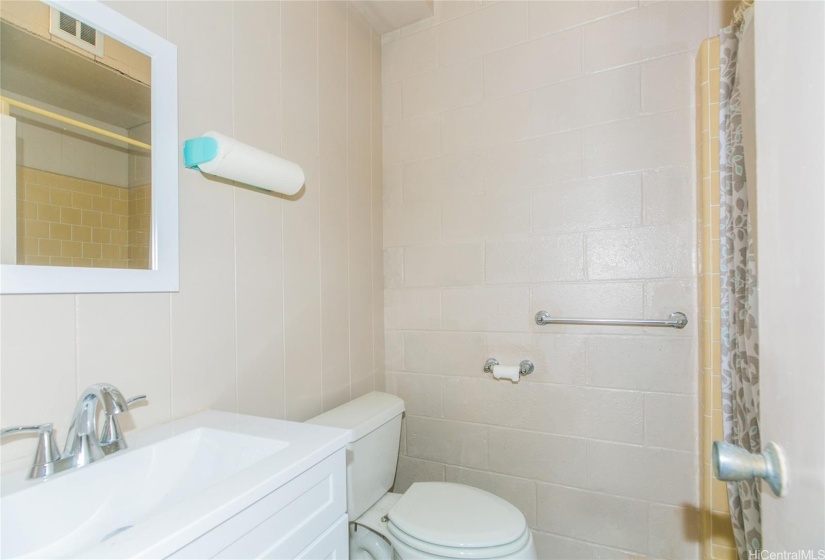 Full bathroom in the rumpus room, next to the garage.