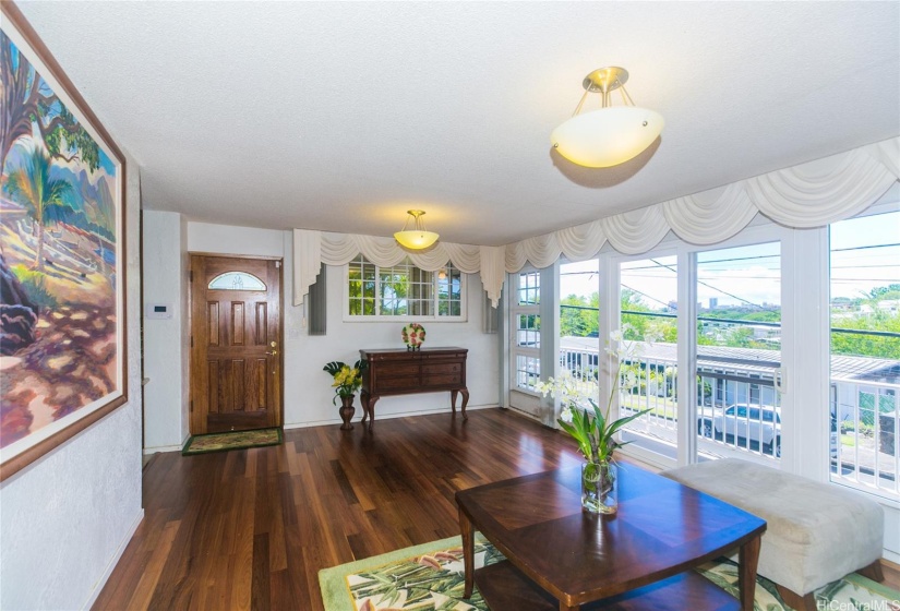 Enter from the front door, living room leads to the hallway and bedrooms or into the kitchen and additional living spaces.