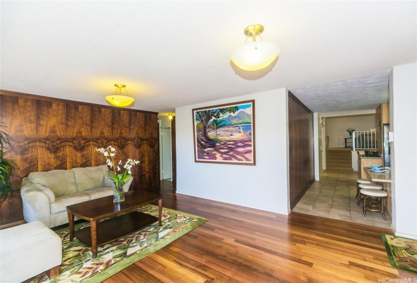 Gorgeous curly koa wood paneling, and mix of natural hard wood flooring, ceramic tiles and carpet throughout the the home.