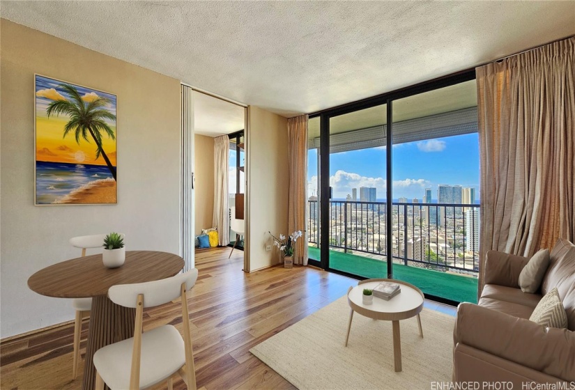 Stunning Views from any room. Brand New Floors. Living room opens to a large balcony and a bonus den/office room to the left. Enhanced, Virtually Staged photo.