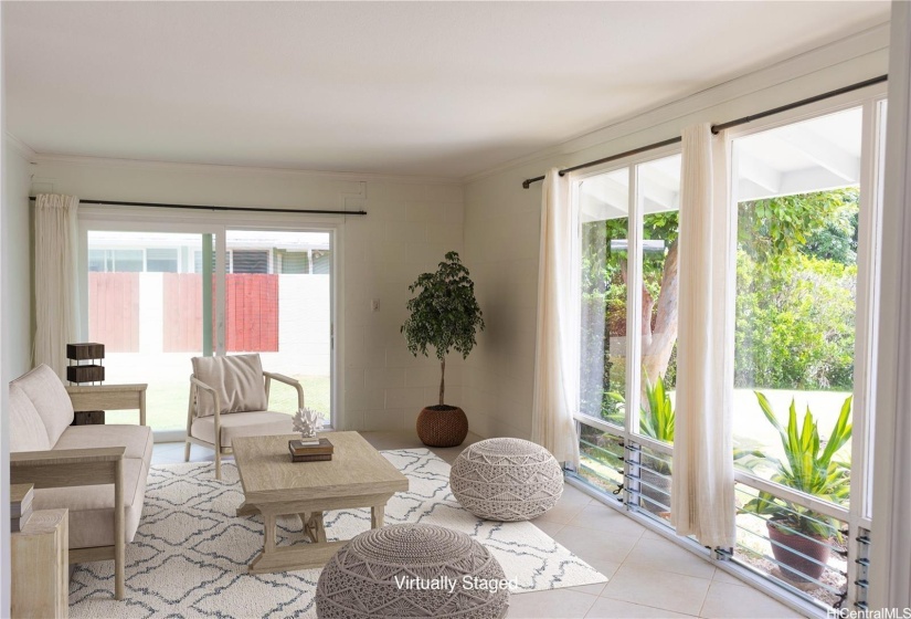 ENCHANCED Living room opens to front and side yards.