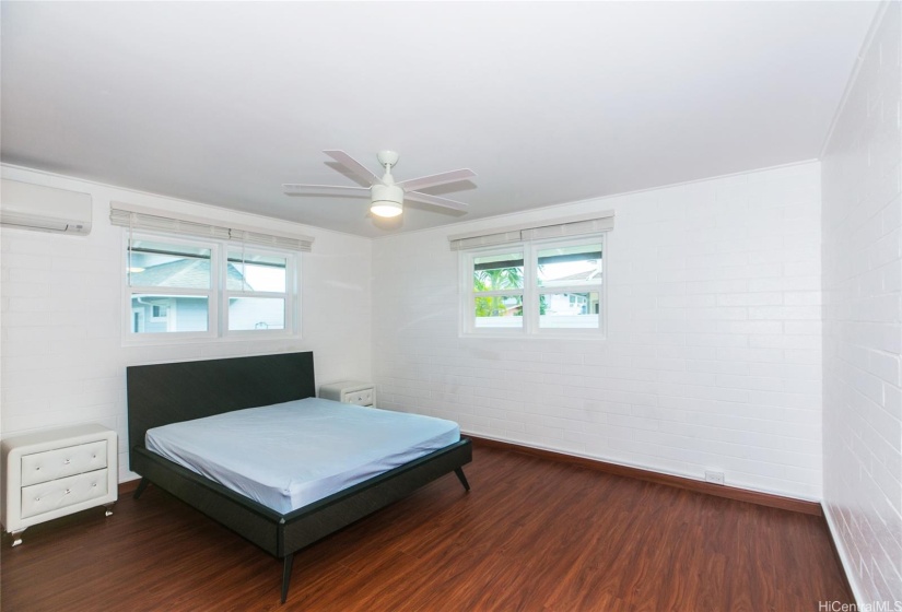 Fourth bedroom with windows on two sides and enough space for two beds