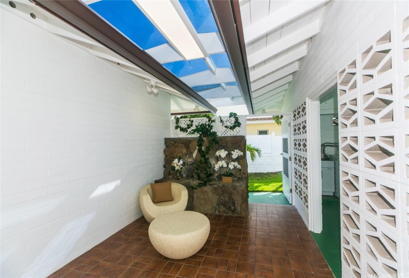 Skylight-covered private patio accessible from the garage or the living room