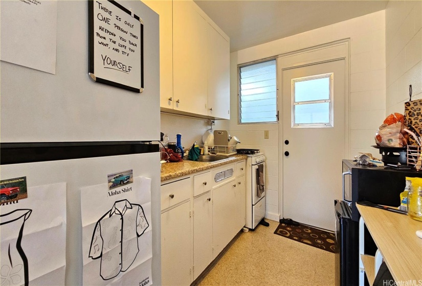 Apt #5:  Kitchen w/new refrigerator.