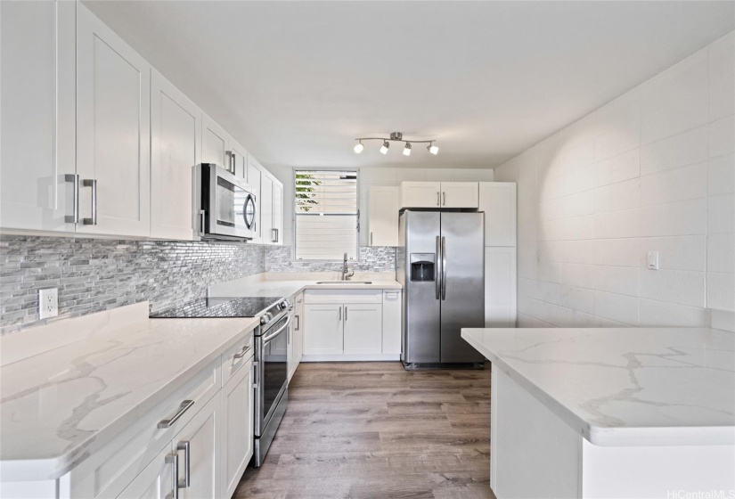 Upgraded beautiful open kitchen.