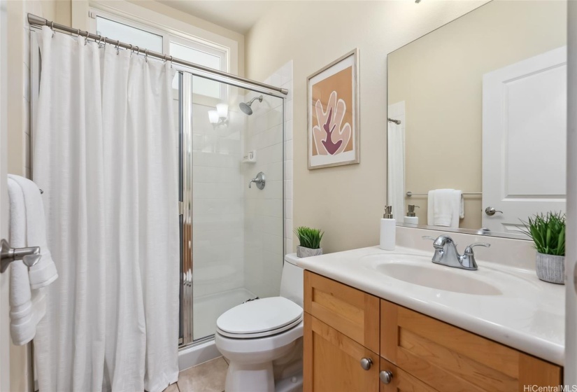 Full bath with walk in shower on the main level of the home.