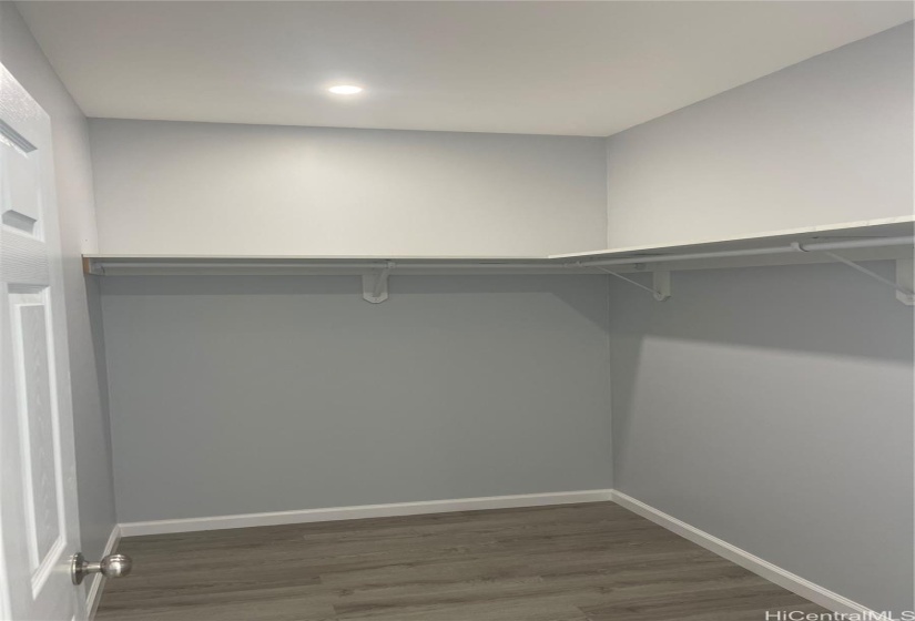 Walk in closet in primary bedroom