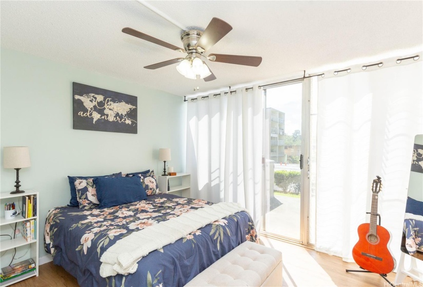 Light, airy and spacious primary bedroom with new closet system in the  closet.