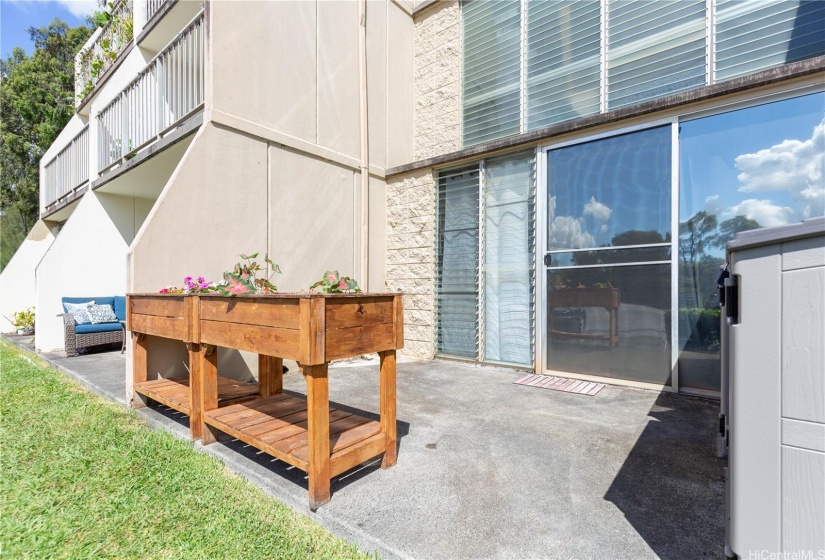 Planters on the ground floor lanai so you can garden or brighten up the main level lanai space with some flowers (with two extra storage sheds that will stay with the condo).