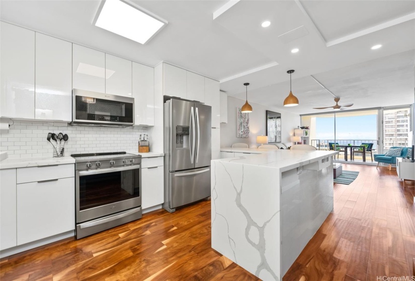 Subway tile back splash with stainless steel appliances.