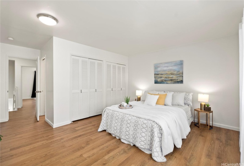 Primary bedroom with ensuite bathroom and private lanai