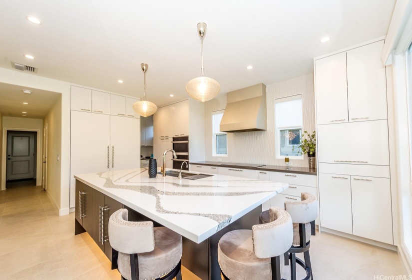 Sparkly clean kitchen with new Quartz countertops, custom backsplash and tons of storage space.