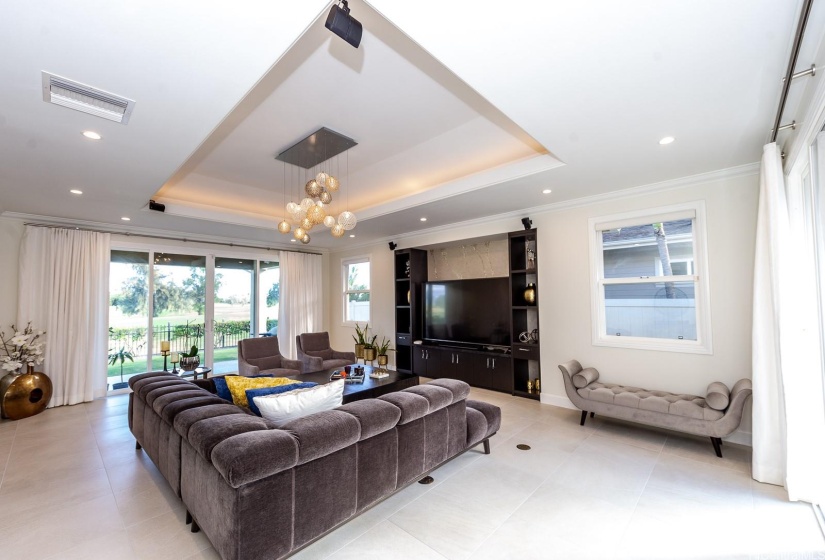 This room is graced with a custom chandelier that the owner special ordered specifically for the living room.