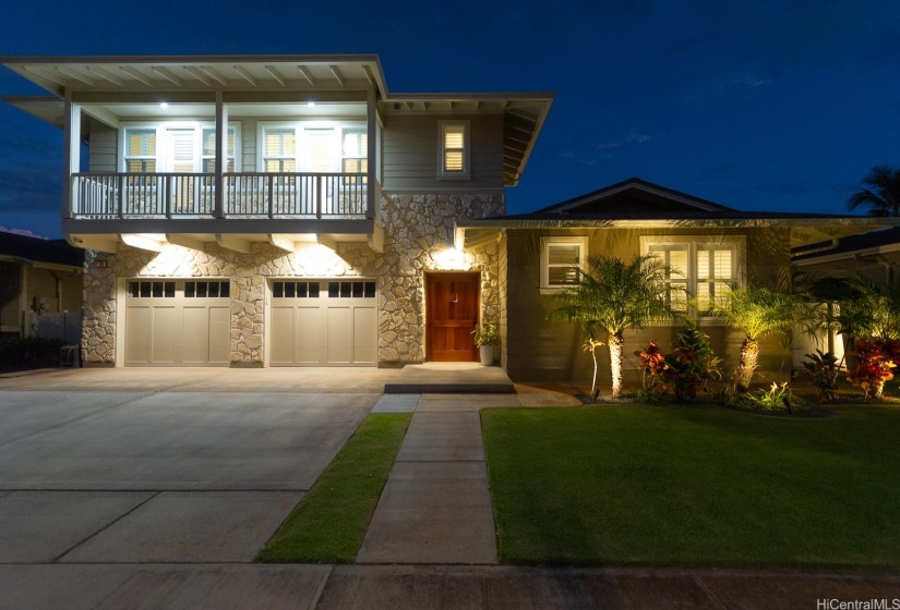 Beautiful home with great curb appeal..evening is lit up.