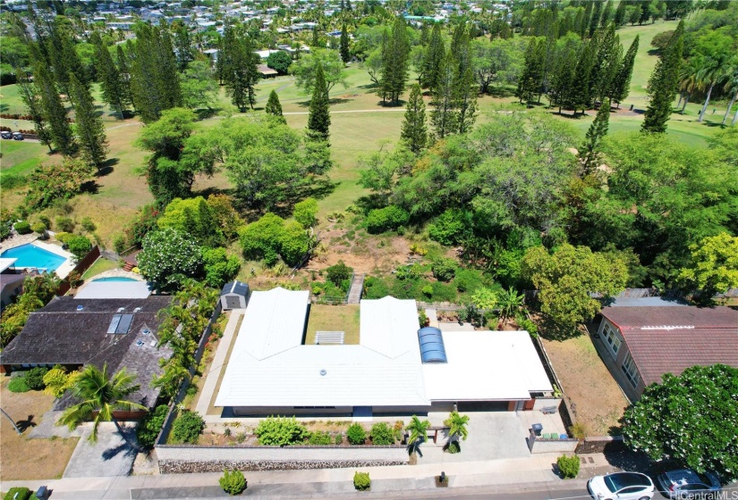 Overhead view of home and golf course behind