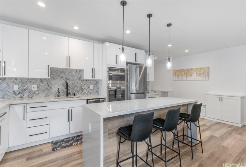 Immaculate open flow main house kitchen with custom built-ins.