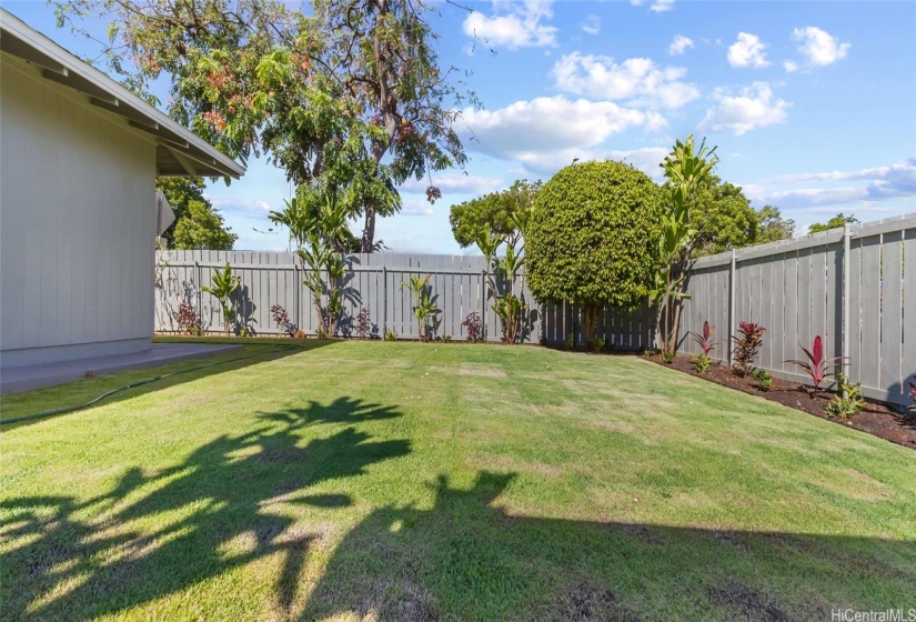 Updated fence and new landscaping.