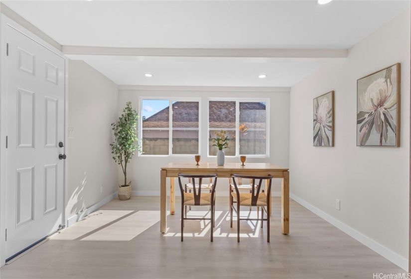 Dining/flex room. White door leads to the backyard, laundry, carport.