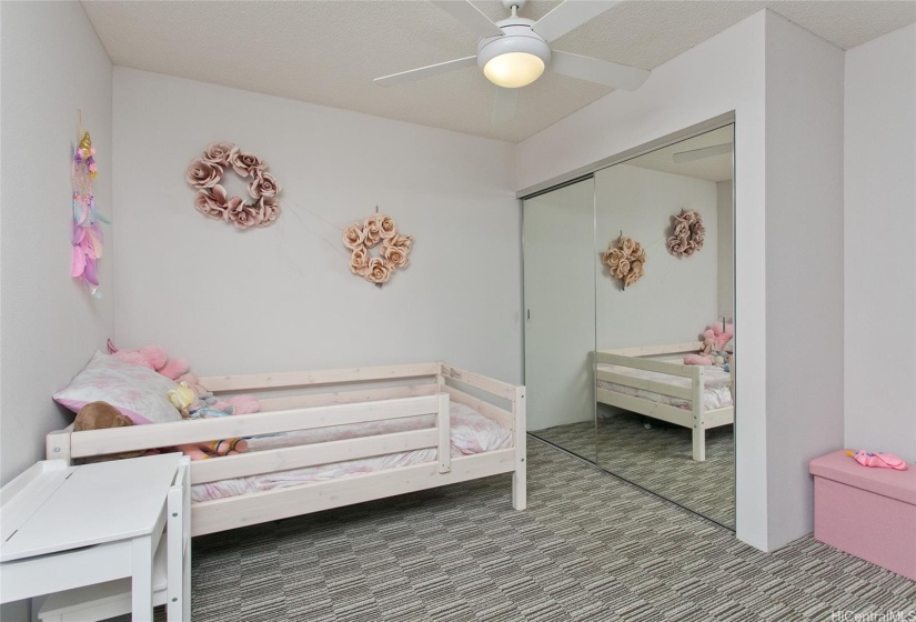 Bedroom three has mirrored closet doors with ceiling fan.   Furniture not included.