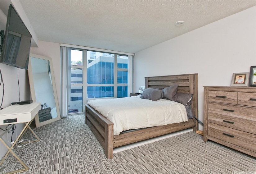 Main master bedroom is spacious and located in its own wing with views of mountain.   Furniture and tv not included.