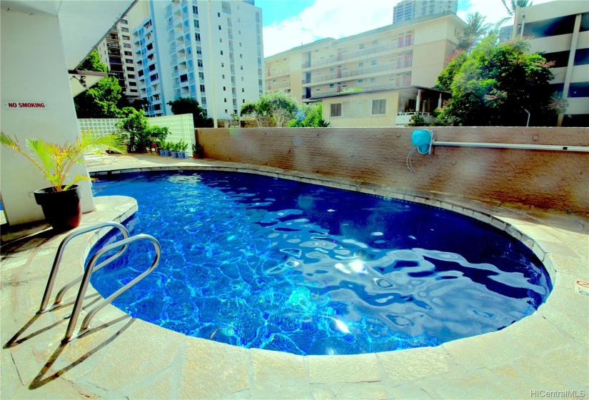 Beautifully tiled pool and recreation area.