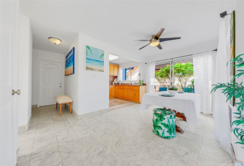 The garage and front doors enter into the hallway that leads into the kitchen, living room and dining areas.