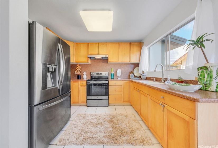 New tall kitchen faucet. Cabinets were installed in previoud kitchen renovations.