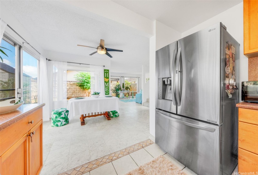 Kitchen flows into the dining and to the left is a sliding door that goes out to the lanai.