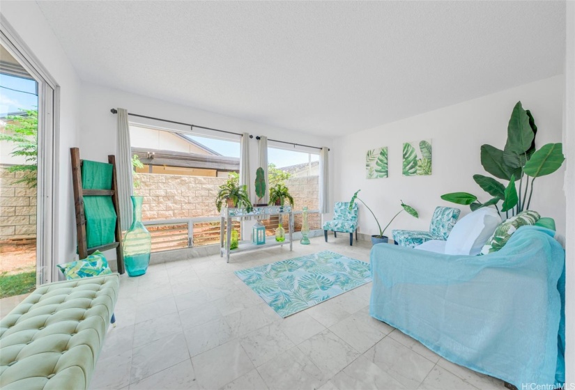 ENHANCEDL Living room overlooks the backyard.