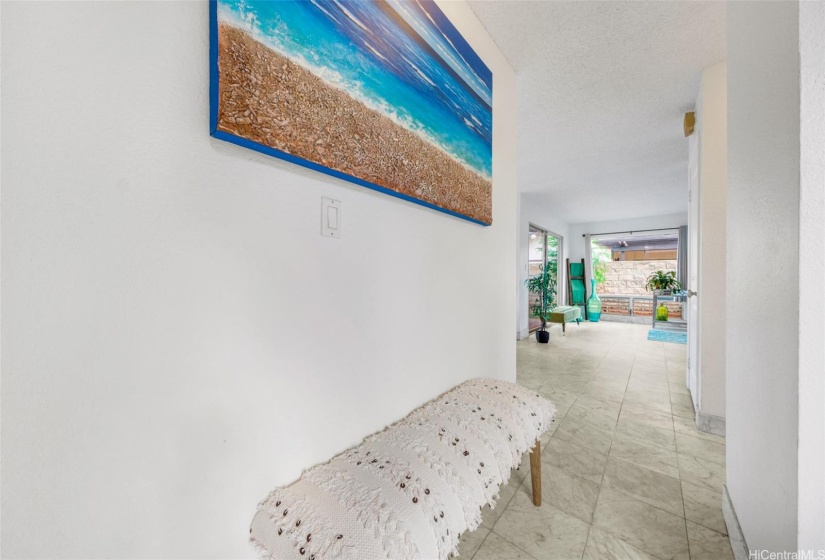 Hallway leads to living  room and dining areas.