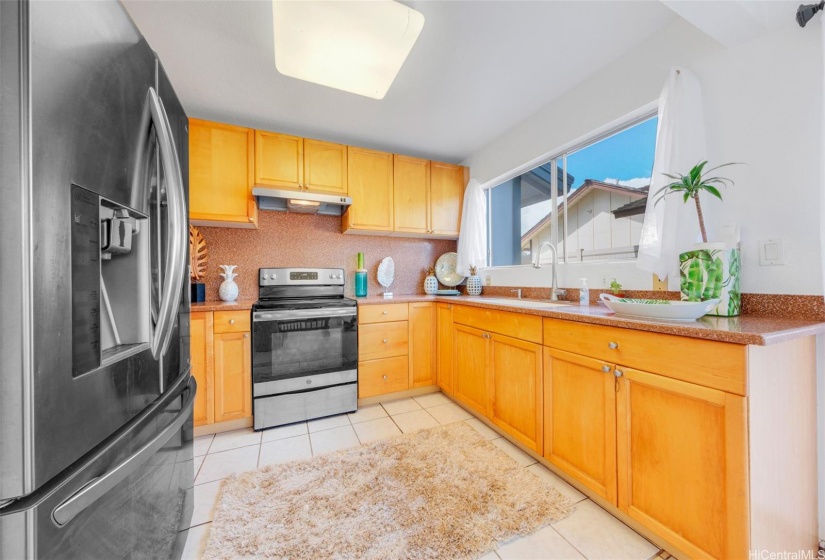 Stainless steel appliances, Corian counter top and cabinets added in past renovations