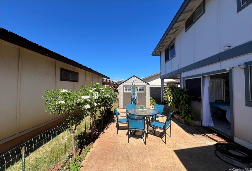 Outside Lanai in a zero lot line with beautiful Hawaiian blue skies overhead. True color of the sky. Next owner can take the fence down if they prefer.