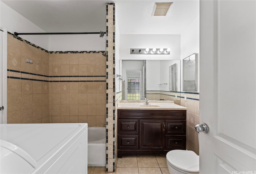 Bathroom vanity and tub.