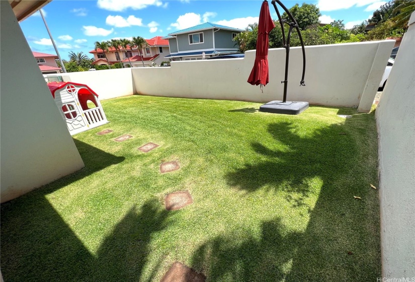 Manicured Mini Yard at the front next to garage