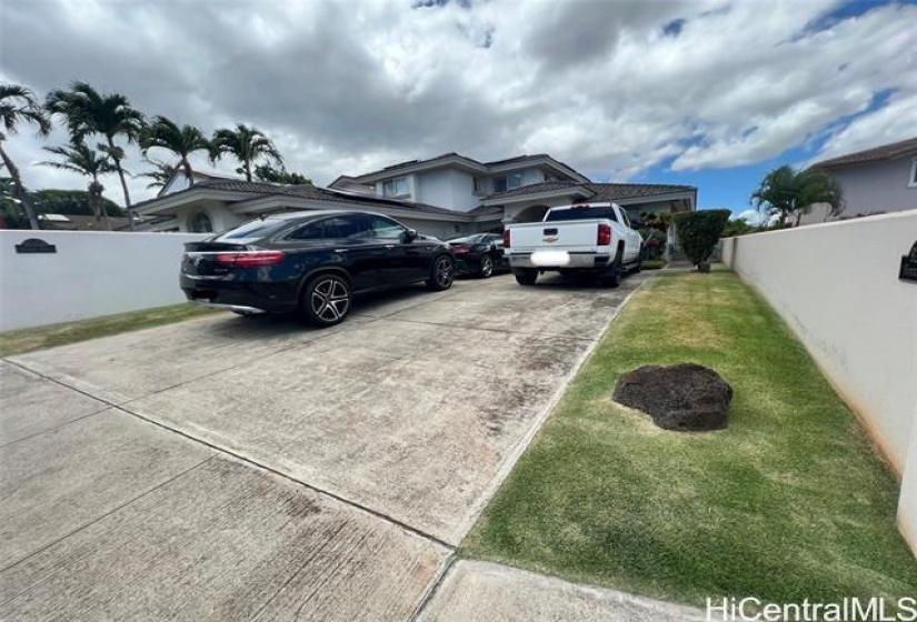 Driveway for 4 cars besides the 3 car garage.