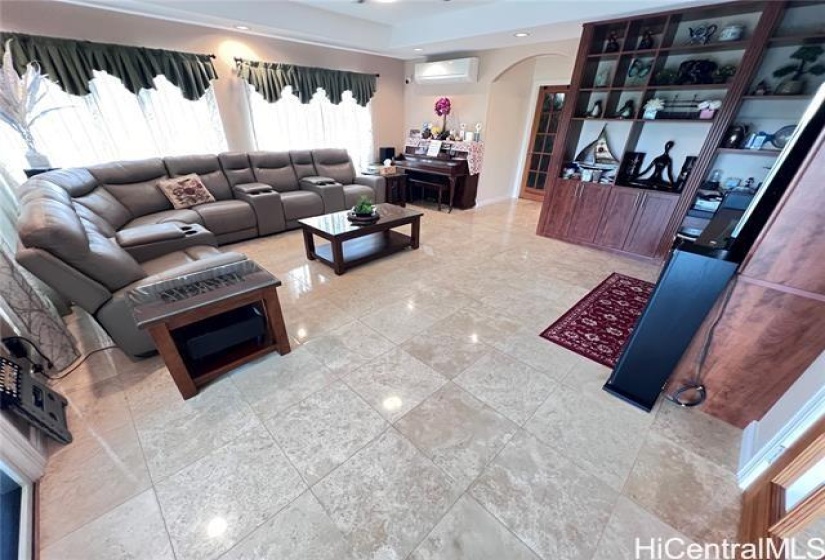 Living Room with built in cabinet.  Split AC & recess lighting.