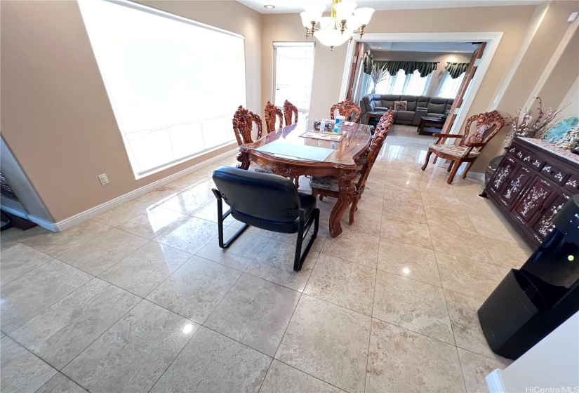 Dining Room from Family Room with recess lighting & chandelier.