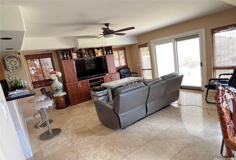 Family Room from Dining Room with access to outside.  Pellas Door with built in blinds, Split AC, ceiling fan, built in cabinet.