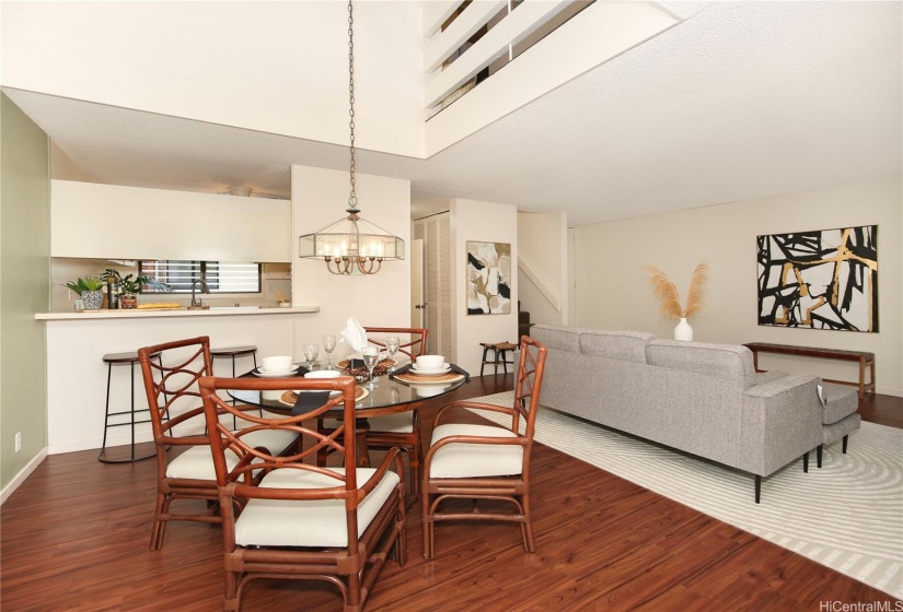 Kitchen has a passthrough eating bar that opens to the dining area.