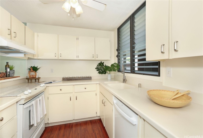 Kitchen offers lots of counter space and a passthrough.