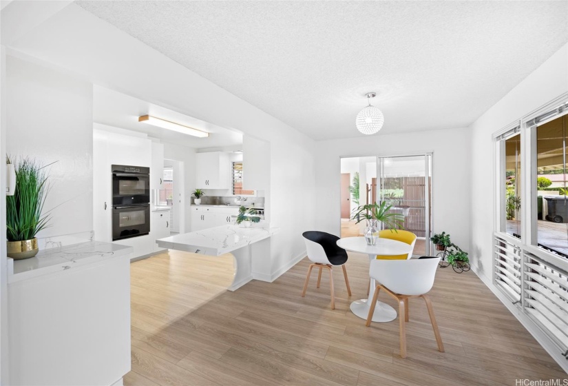 Dining area access through sliding glass door out to patio and carport.