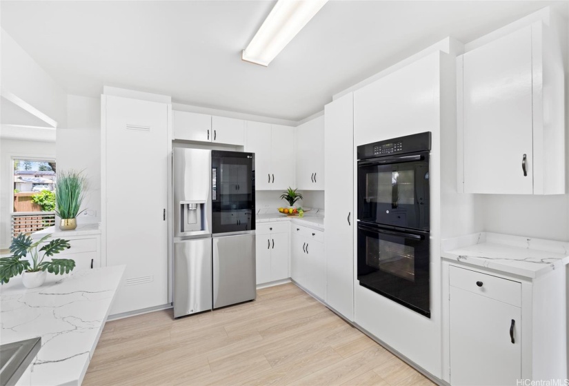 Kitchen with new refrigerator.