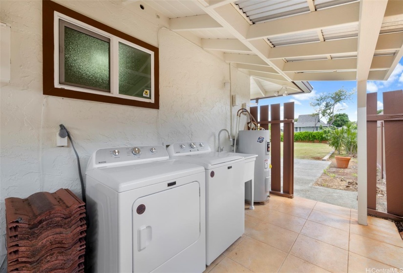 Outdoor washer and dryer with basin.